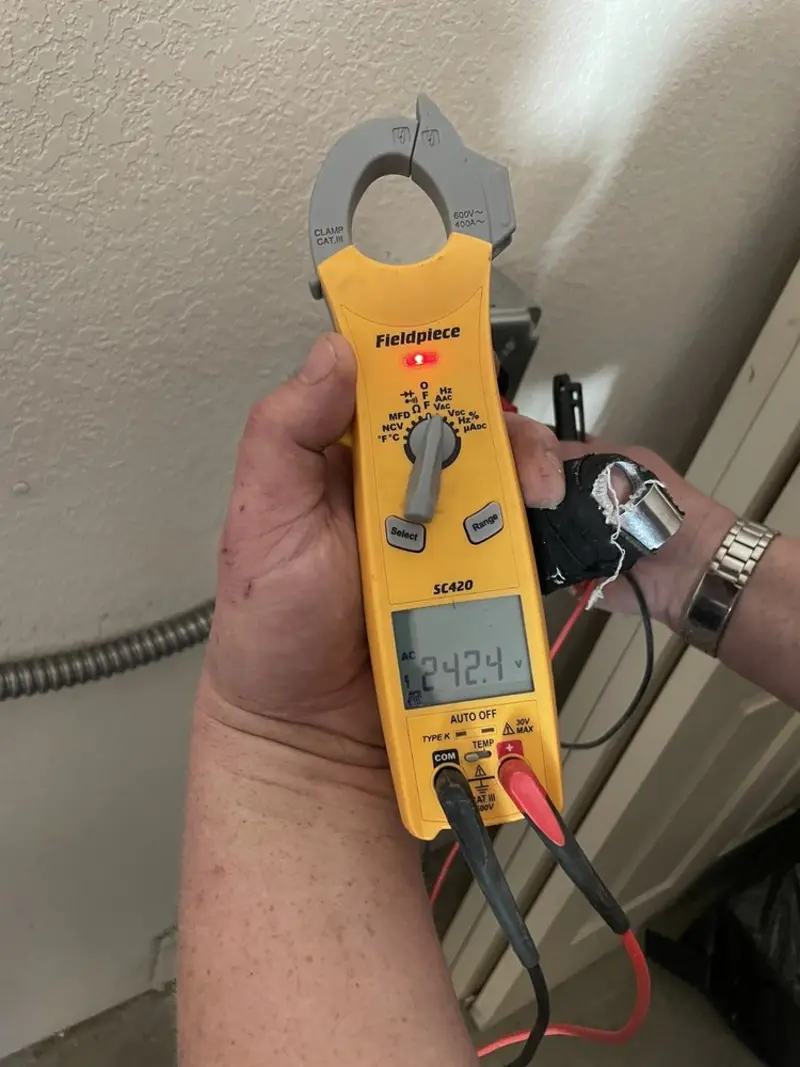Voltage testing with clamp meter during Ceiling Fan Installation in Columbia